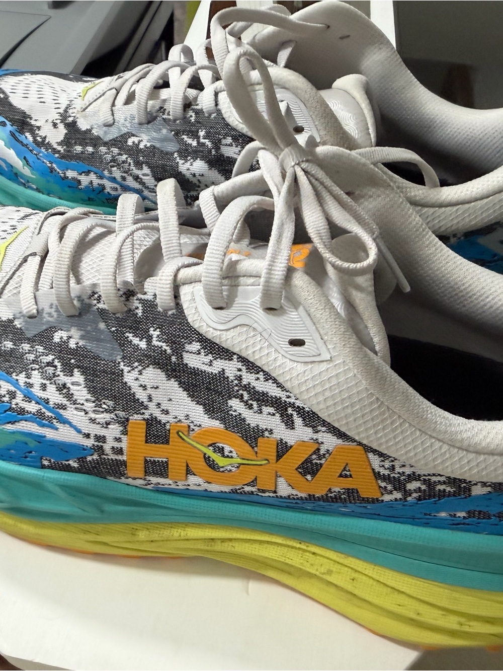 Hoka White, Blue & Yellow Graphic Running Shoes